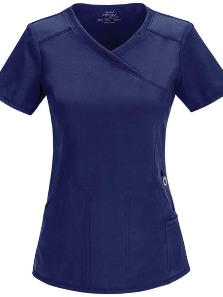 A frontward facing image of the Cherokee Infinity Women's Antimicrobial Mock Wrap Top in navy size medium featuring a left scissor pocket & one interior pocket.